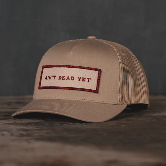 Ain't Dead Yet Tan Trucker Hat